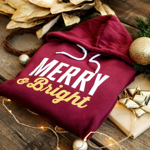 Merry & Bright - this ultra soft and cosy hoodie for women is available in festive maroon and green colours. Perfect for all of your cosy holiday activities or as a christmas gift for the women in your life