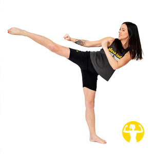 Dark grey cropped racerback tank with a saying that reads Sore Today, Strong Tomorrow. Model is a fitness instructor, demonstrating kickboxing moves in Barrie, Ontario Canada.