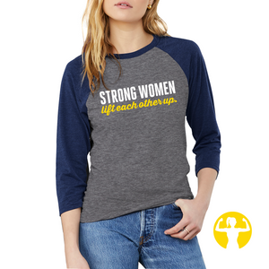 Strong women lift each other up. You'll love the fit and feel of this classic baseball shirt! The raglan 3 quarter sleeves take on a fresh update with a super soft blends of combed and ring-spun cotton, a modern fit, three-quarter contrast raglan sleeve. Made of 50% poly, 25% Airlume combed and ring-spun cotton, 25% rayon.