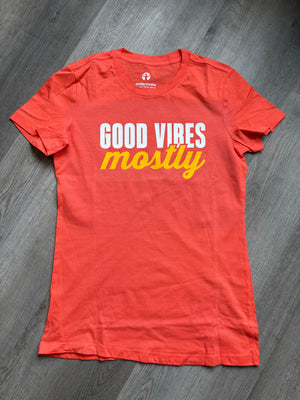 Orange t-shirt with words Good Vibes Mostly
