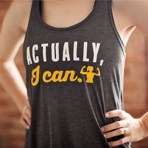 Actually, I Can - Dark Grey Flowy Racerback Tank Top for Women. Perfect for the gym or casual wear, the light fabric dries quickly and the sheering on the back adds a nice feminine detail.