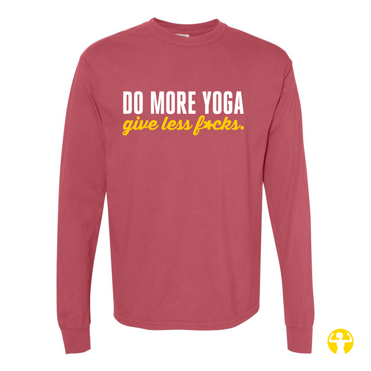 Flat lay view of a washed vintage Crimson red Comfort Colors long sleeve shirt featuring the text 'Do More Yoga, Give Less F*cks' printed across the chest in bold white block lettering and bright yellow script, on a light beige background.