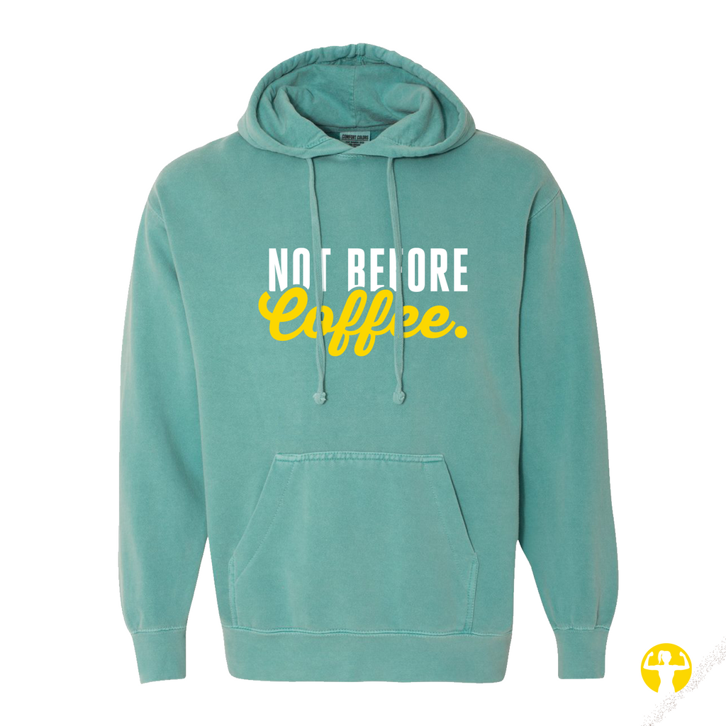 A mint green pullover hoodie with a front kangaroo pocket and drawstrings, featuring the text 'NOT BEFORE Coffee.' printed on the chest in white and yellow.