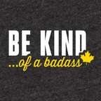 A close-up of a dark heather gray fabric surface with printed text 'BE KIND... of a badass"