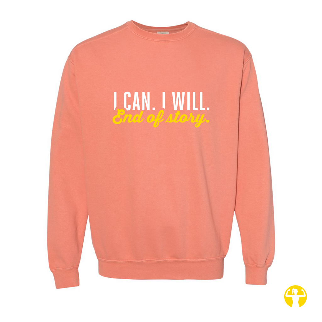 A coral pink crewneck sweatshirt with the text 'I CAN. I WILL.