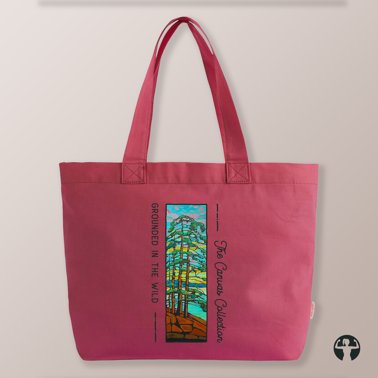 A red canvas tote bag with dual shoulder straps, featuring a colourful stained-glass-style forest graphic and the text 'The Canvas Collection' and 'Grounded in the Wild' printed on the front, shown against a neutral beige background.