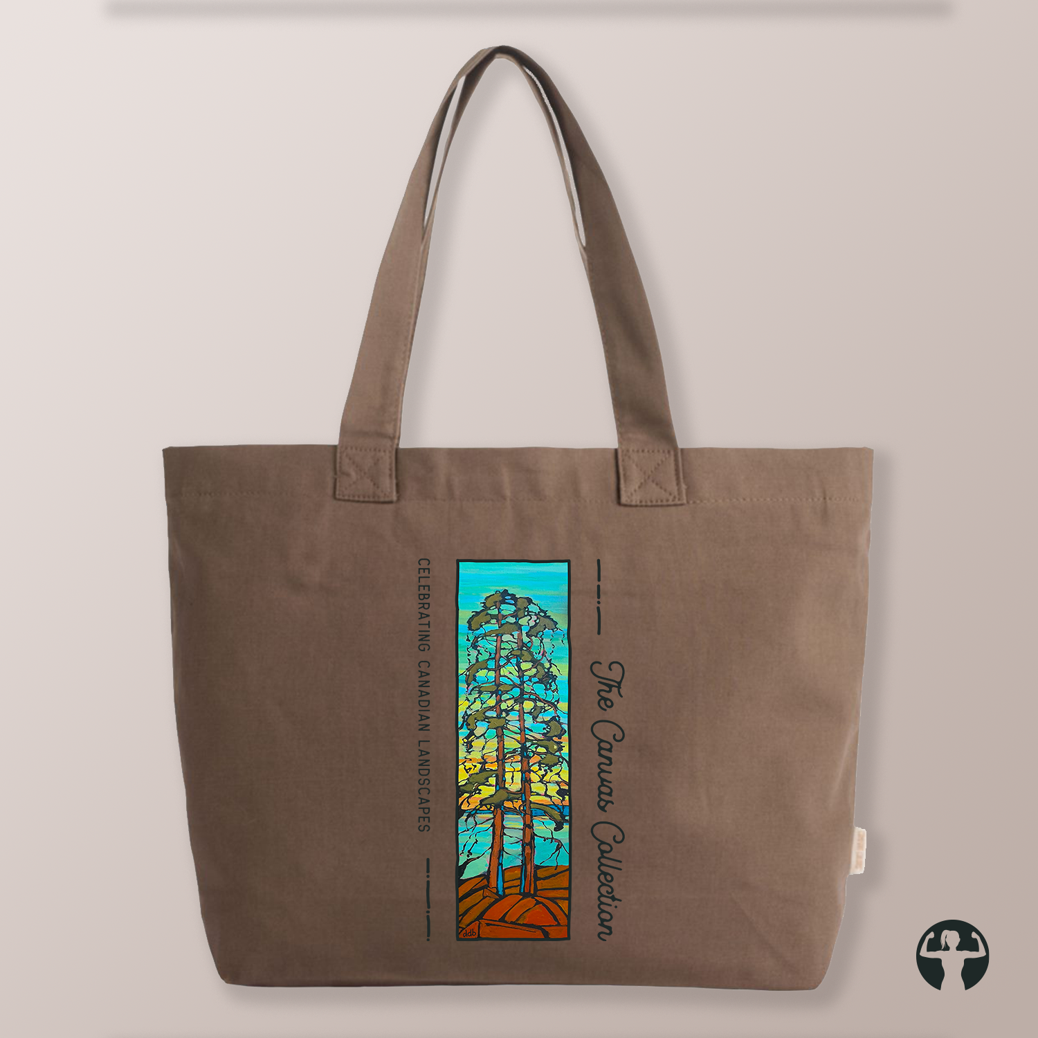 A brown canvas tote bag with a colorful graphic print of stylized trees and the text 'The Canvas Collection' and 'Celebrating Canadian Landscapes', shown against a neutral beige background.