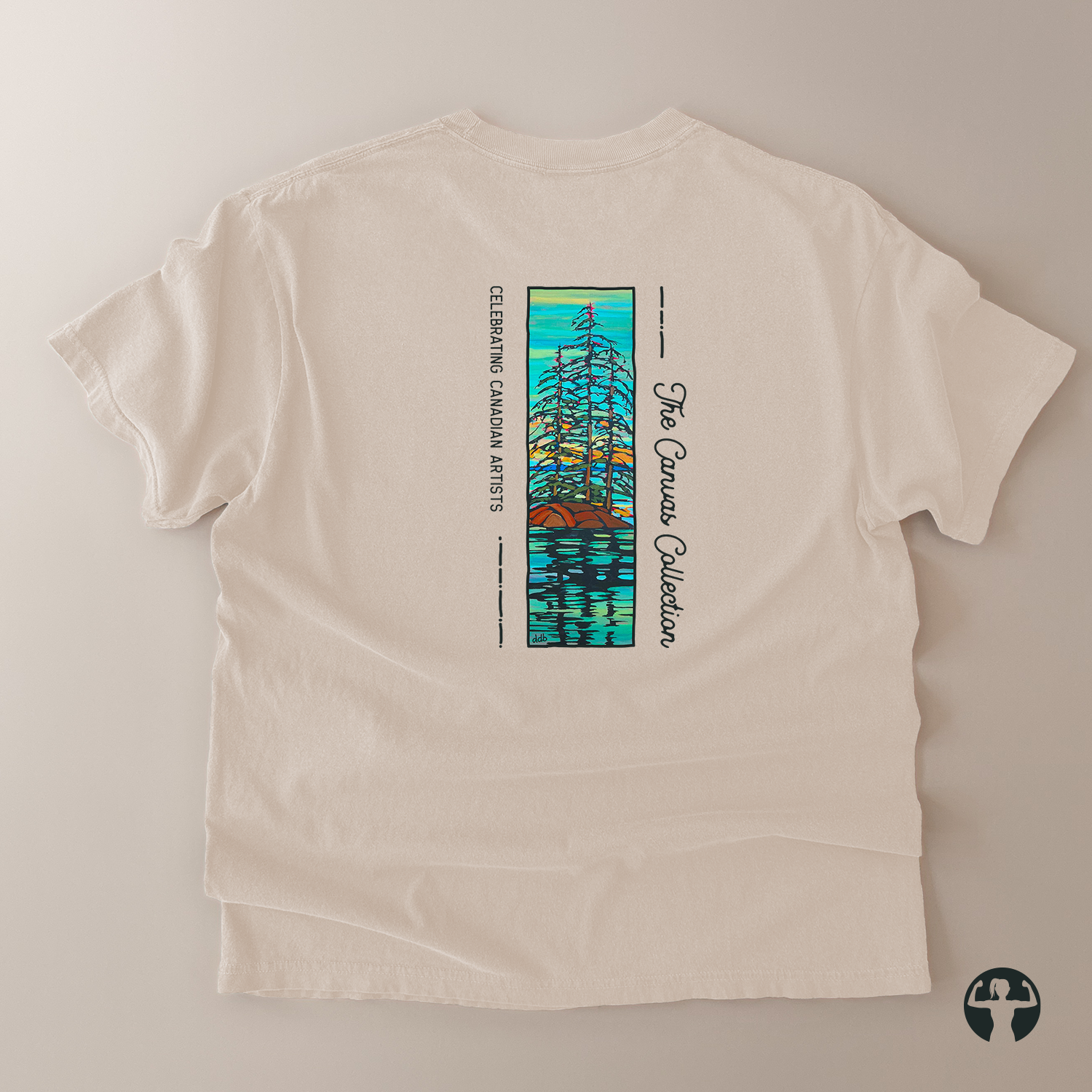 An off-white short-sleeve t-shirt laid flat on a light beige background, featuring a vertical graphic print on the back with a colorful sailboat illustration and the text ''Canvas Collection's' and 'Celebrating Canadian Artists'.