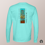 A light aqua long-sleeve t-shirt shown from the back, featuring a vertical graphic print of a stylized tree with autumn leaves and text including 'Celebrating Canadian Landscapes' and 'The Canvas Collection'.