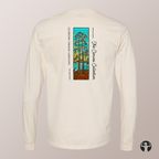 An off-white long-sleeve t-shirt shown from the back, featuring a colorful graphic of stylized trees in a stained-glass style with the text 'The  Canvas Collection' and 'Celebrating Canadian Landscapes'.