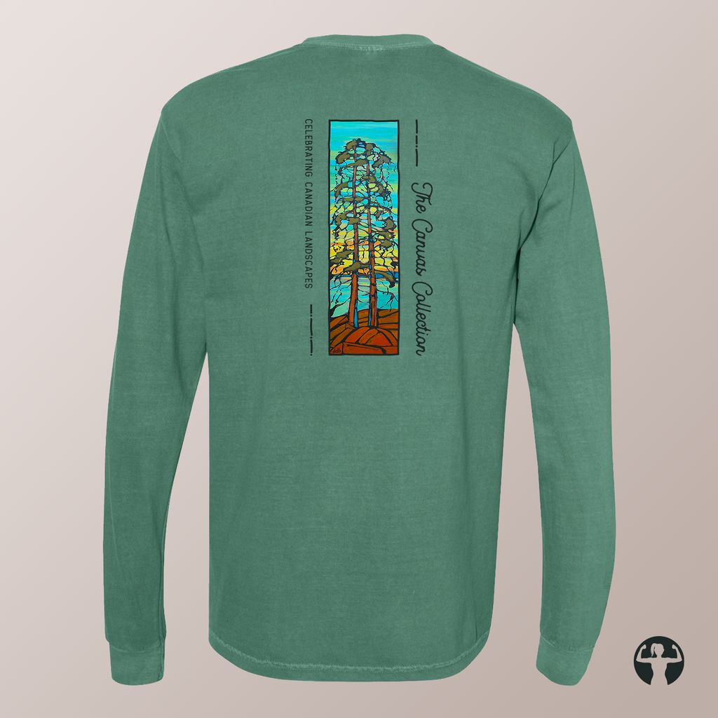 A heather green long-sleeve t-shirt shown from the back, featuring a large graphic print of three stylized trees with a blue sky and orange ground, along with vertical text reading  'Celebrating Canadian Landscapes' and 'The Canvas Collection'.