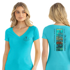 A woman modeling a bright turquoise V-neck T-shirt shown from the front and back against a plain white studio background. The front has a small dark chest graphic, and the back has a large multicolor tree illustration with vertical text reading 'Spa Council of California' and 'Est.