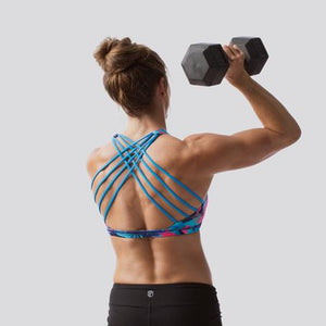 Sports bras for female athletes. This Pink Palm sports bra design is perfect for summer and can double as a bikini top! Made by Born Primitive, available online from Asskicker Activewear in Barrie Ontario Canada.