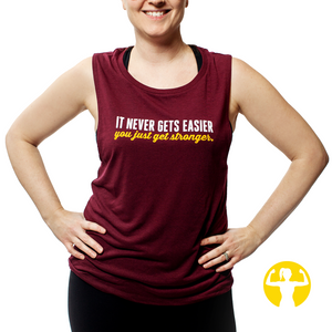 Maroon coloured gym tank for woman with a saying that reads it never gets easier, you just get stronger.