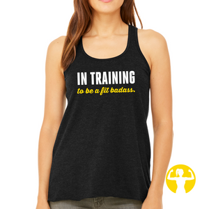 Empowering or motivating graphic tees and tank tops for women. In training to be a fit badass, black flowy racerback tank top from Asskicker Activewear in Canada.