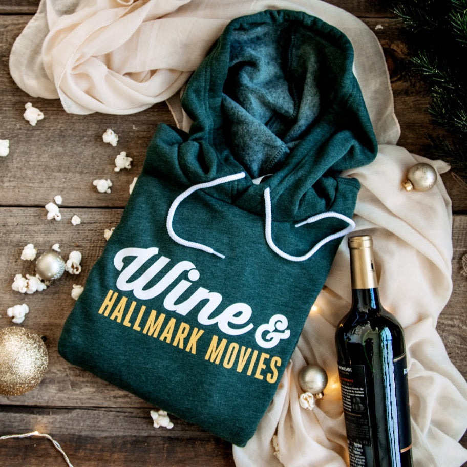 Wine & Hallmark Movies - This pullover hoodie is remarkably soft with a loose fit that is versatile and lends itself to daily wear. Spun from a plush fabric that is made up of cotton and polyester fibers, this hoodie features an up-to-date fit, hood with white drawcords, kangaroo pocket, ribbed cuffs and waistband.