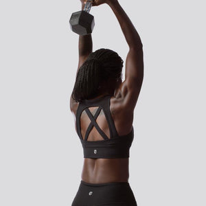 Supportive sports bra with criss cross straps for female athletes . Available online from Asskicker in Canada.